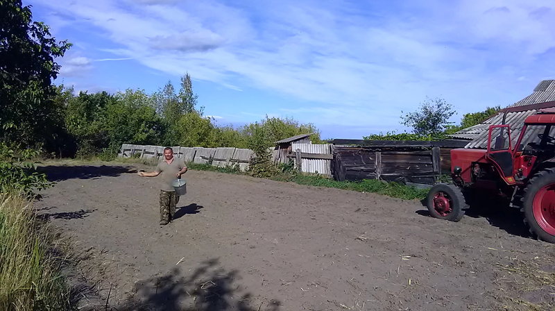 A team member planting grain seeds by hand in September 2017.